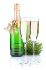 Champagne bottle, glasses and christmas decor