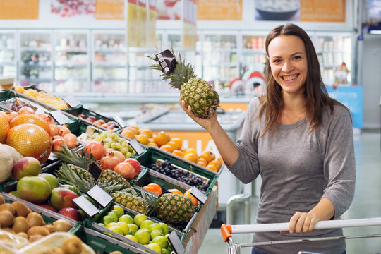 happy woman in supermarket