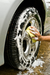 man and sponge for cleaning car and washing car