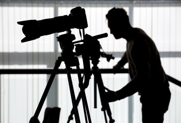 Silhouette of photographer and cameraman