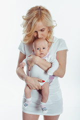 Portrait of a beautiful woman kissing baby