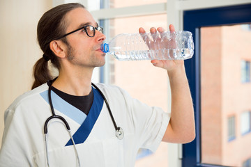 male nurse is drinking water