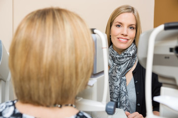 Optometrist Using Tonometer to Measure Patients Eye Pressure