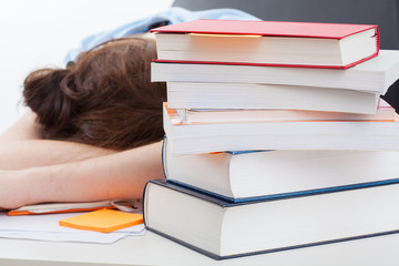 Student sleeping after long studying