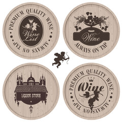 four labels for wine on wooden casks