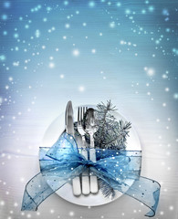 Christmas table place setting with christmas decorations