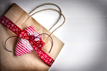 Valentine's gift bag with red ribbon 