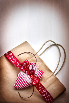 Valentine's gift bag with red ribbon 