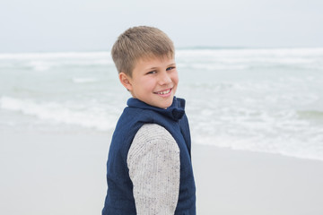 Portrait of a cute smiling boy at beach