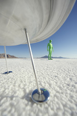 Alien Visitor Standing Under Spaceship