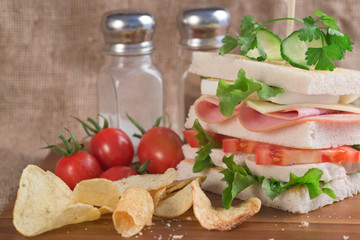Fresh club sandwich in rustic kitchen setting