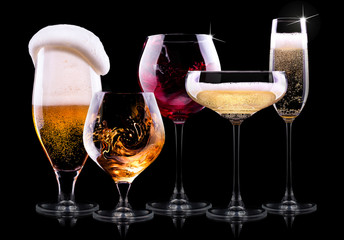 set with different drinks on black background