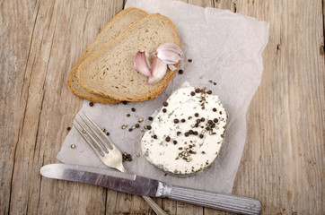 soft cheese with herbs and bread