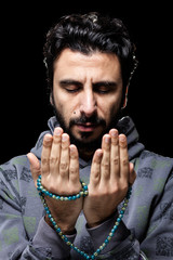 Western Muslim Praying with Tasbih