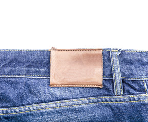 Blank leather label on blue jeans