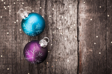 Christmas decoration ball on textured grungy wooden surface