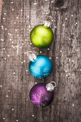 Christmas decoration ball on textured grungy wooden surface