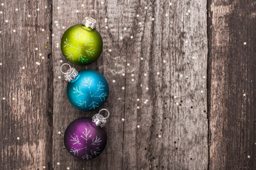 Christmas decoration ball on textured grungy wooden surface