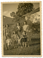 Three young mothers with their children - circa 1950