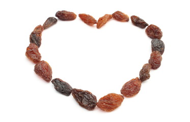 Heart of raisins isolated on white background