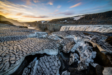 Snow cracks in Dettifoss waterfall during sunset, Iceland