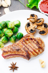 Grilled pork chop with brussels sprouts