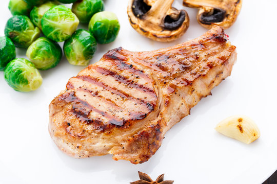 Grilled pork chop with brussels sprouts