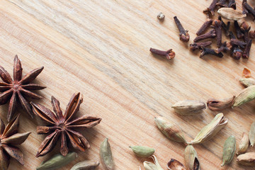 Wooden background texture with aromatic spices