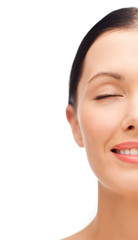 Obraz premium smiling young woman with closed eyes