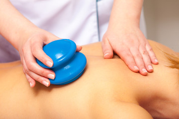Spa salon. Woman relaxing having cupping massage. Bodycare.