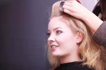 Blond girl hair curlers rollers hairdresser beauty salon