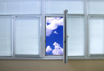 Sky view through an open window in room