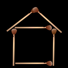 house from matches on a black background