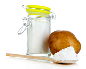 Starch in spoon with potatoes isolated on white