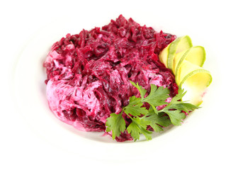 Beet salad on plate isolated on white