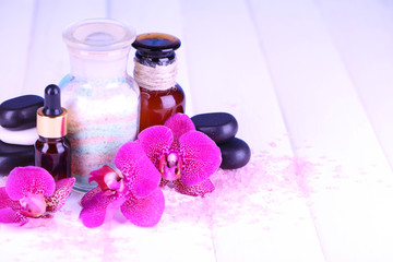 Beautiful spa setting with orchid on white wooden table