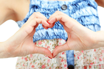 Woman hands making sign Heart close up