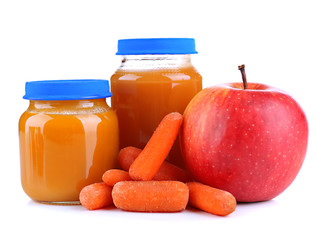 Baby food with carrot and apple in glass jars, isolated on