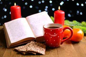 Composition of book with cup of coffee and Christmas