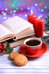 Composition of book with cup of coffee and Christmas
