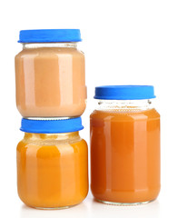 Baby food in glass jars, isolated on white