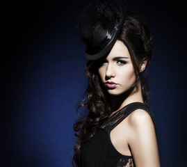 Fototapeta premium Portrait of young and beautiful woman in retro style