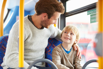 Father And Son Enjoying Bus Journey Together