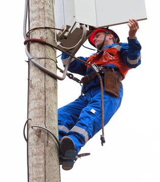 Electrician opened the control panel on the pole reclosers