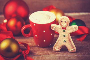 Coffee cup with cookie.