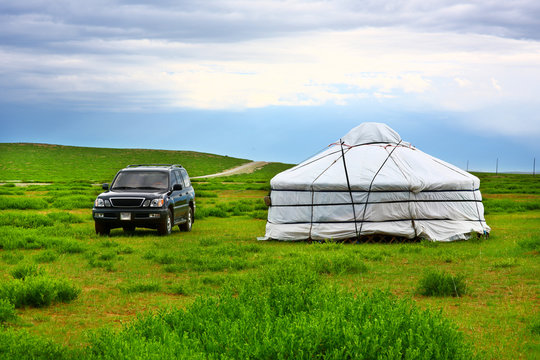 Jeep parked next to yurt