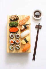 delicious sushi served on wooden board