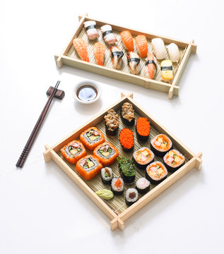 Japanese seafood sushi , rolls and chopstick for two plates