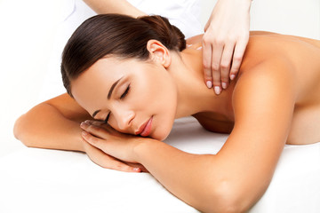 Obraz na płótnie Canvas Massage. Close-up of a Beautiful Woman Getting Spa Treatment