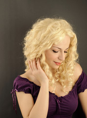 Naklejka premium Pretty girl with curly blond hair